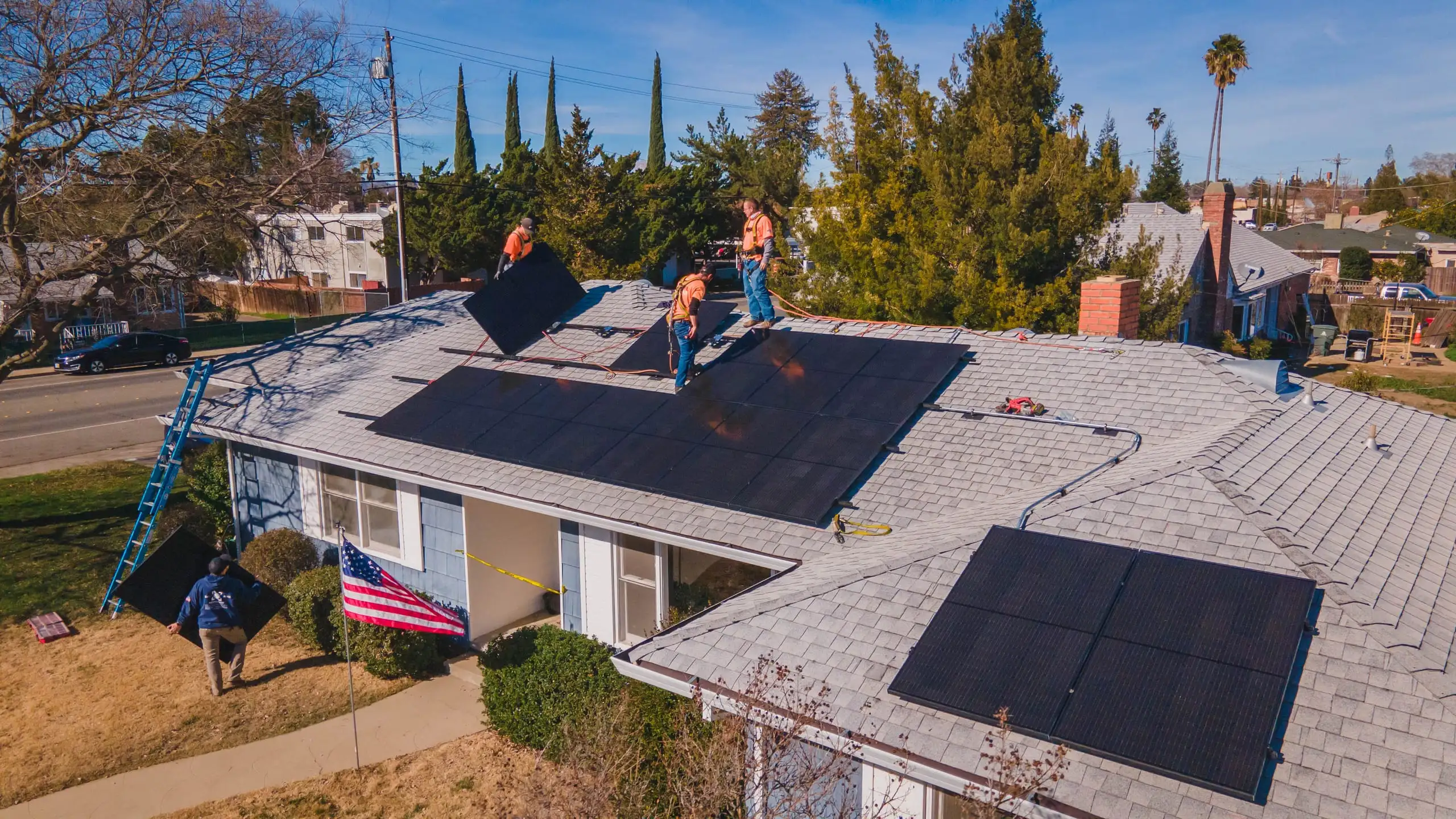 Aerial view of a Westhaven crew installing black solar arrays across the roof of a Nor-Cal home.
