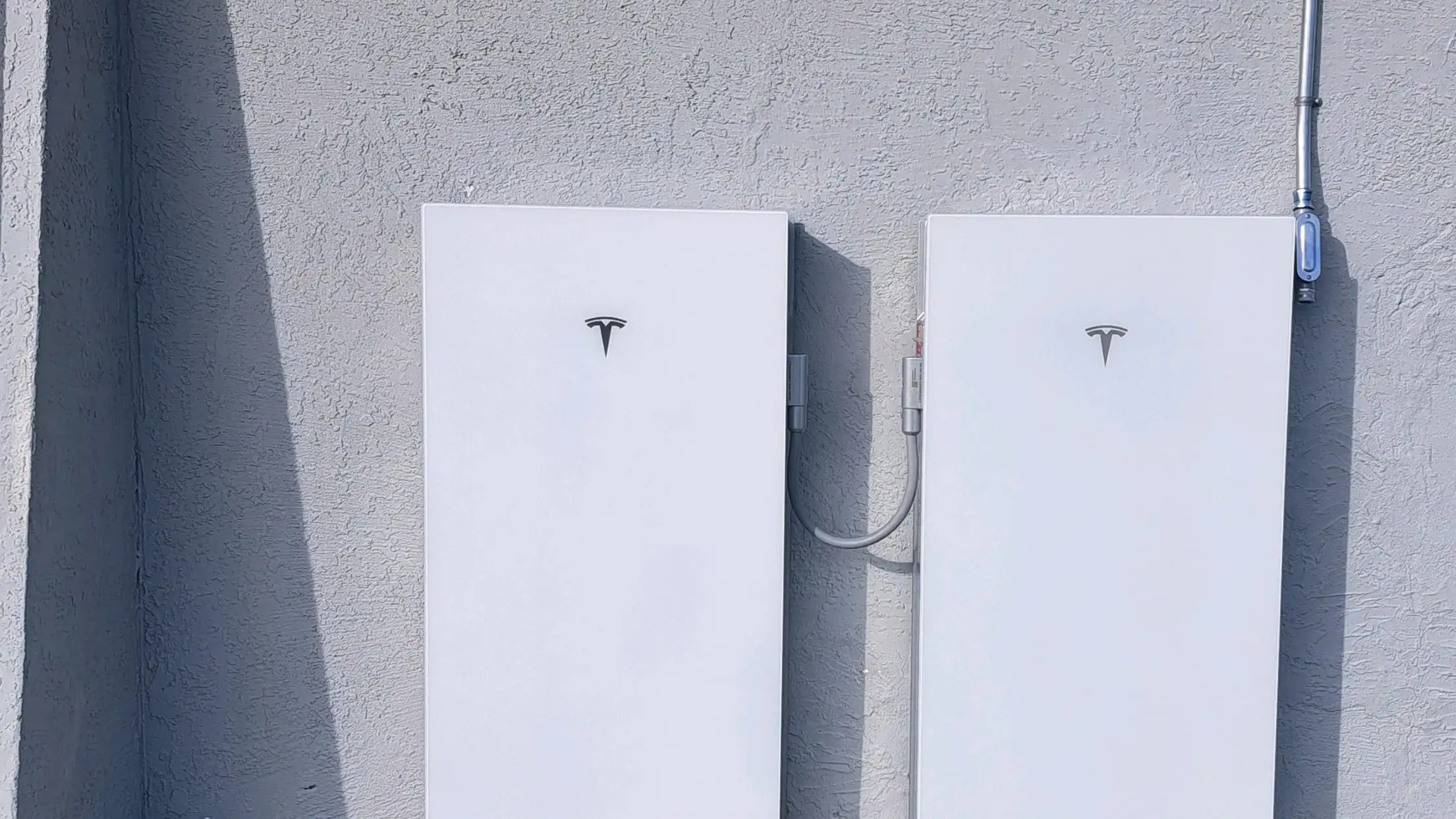 Two Tesla Powerwall units installed side by side on the wall of a Northern California home.