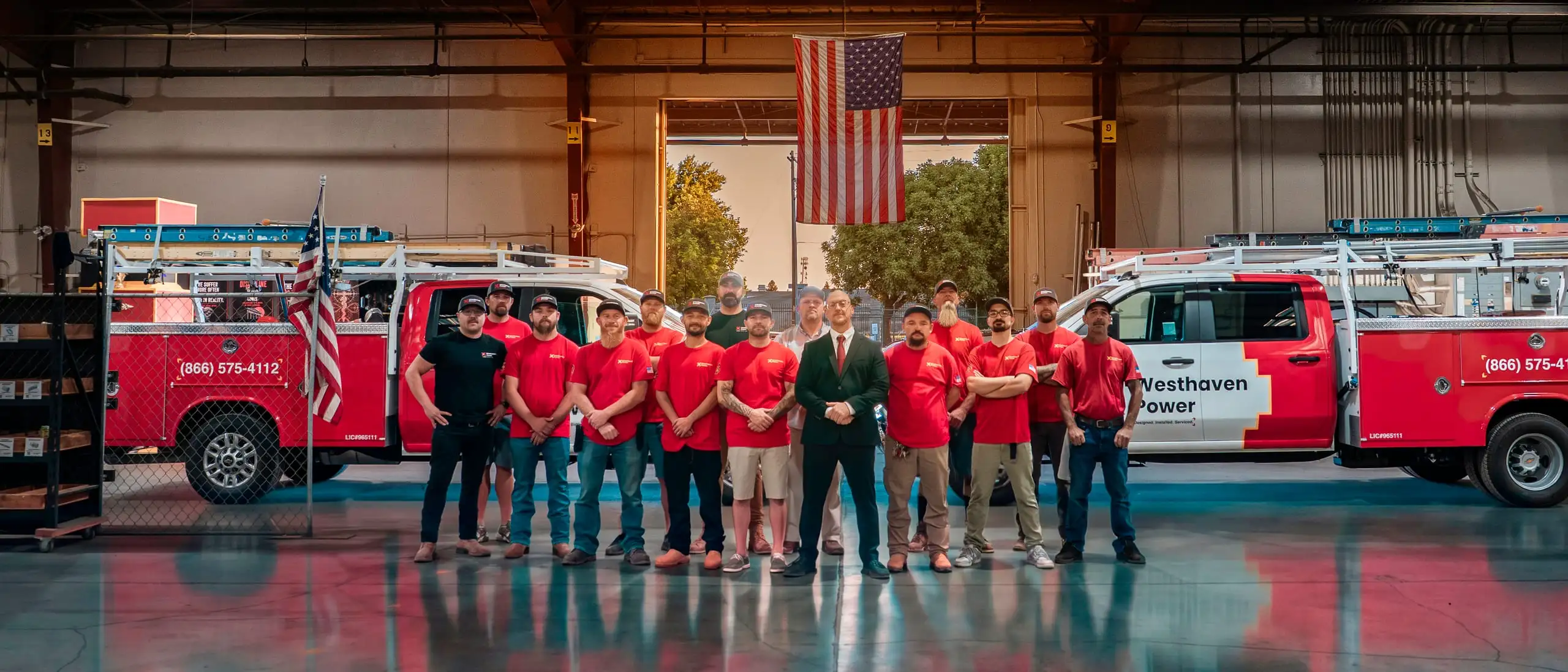 The Westhaven Power team with the company fleet inside the warehouse.
